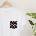 Daruma Pocket Tee hanging on rail